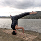 Man doing the tripod yoga pose on the Barong ZenMotion yoga cork mat