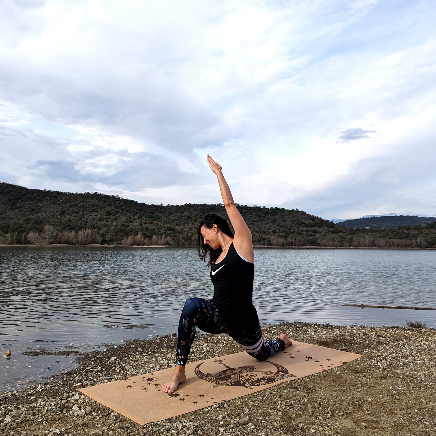 Woman doing the anjaniasana yoga pose on the Fairy Night ZenMotion cork yoga mat