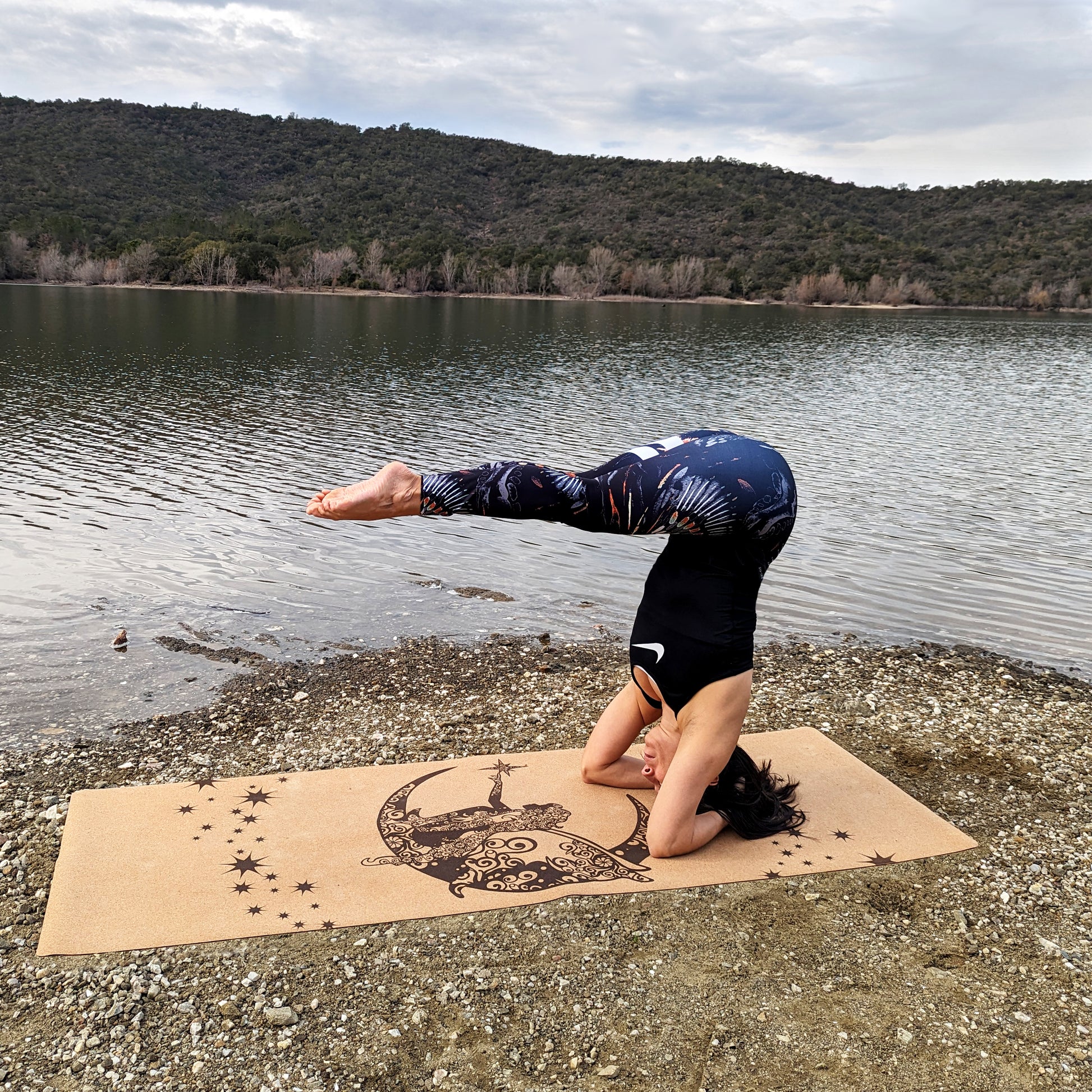 Woman doing a headstand on the Fairy Night ZenMotion cork yoga mat