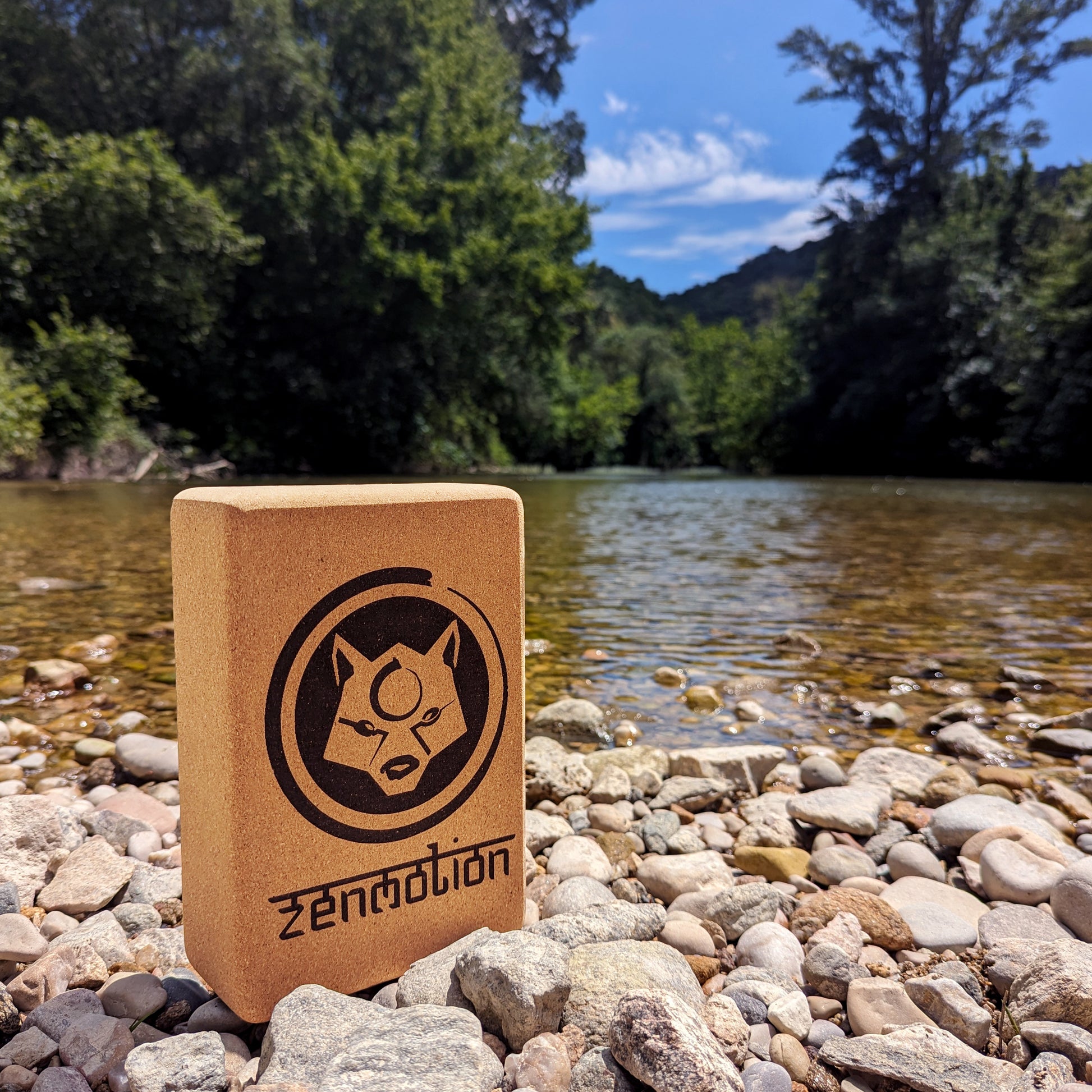 A ZenMotion Cork Yoga Block on a river background. 