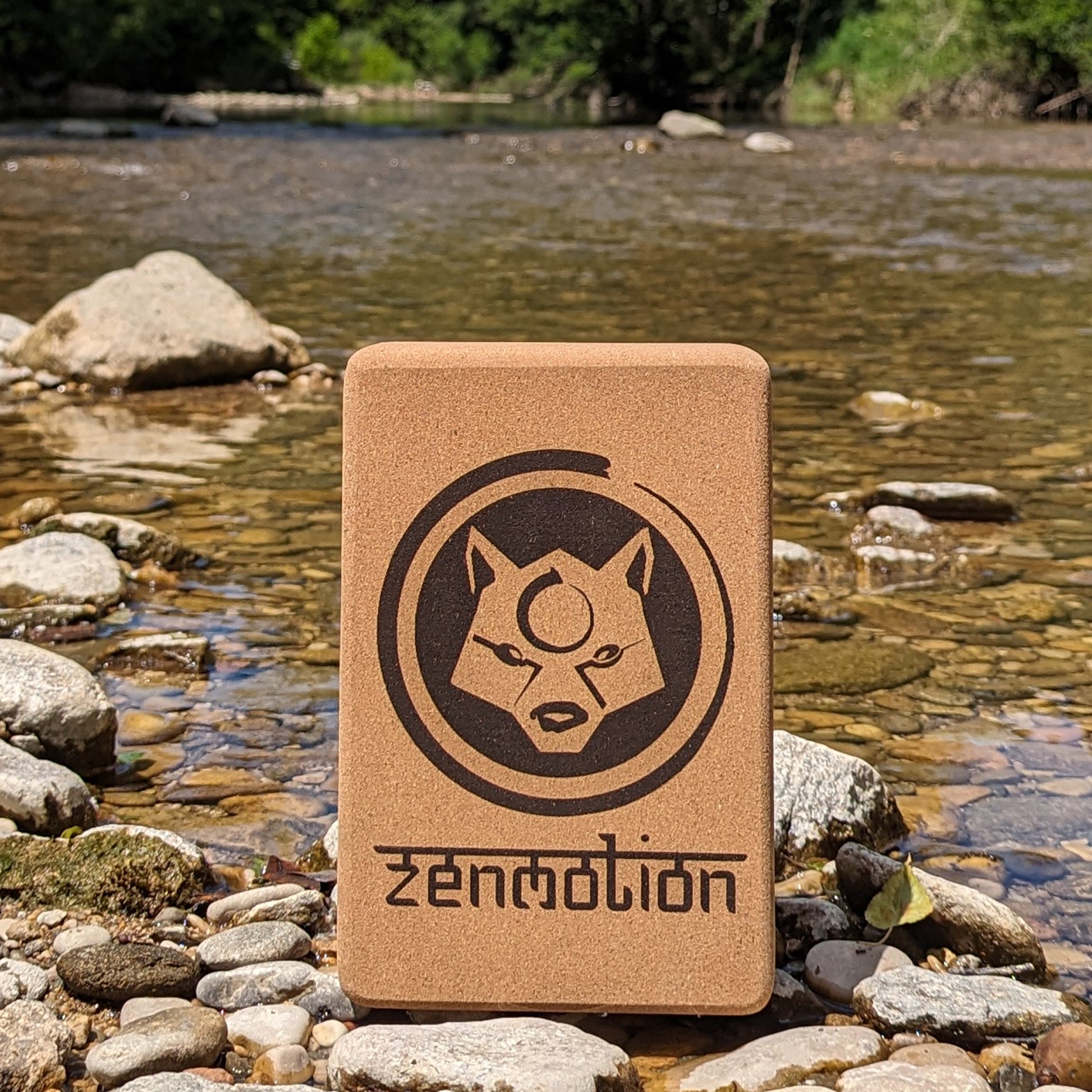 A ZenMotion Cork Yoga Block on a river background. 