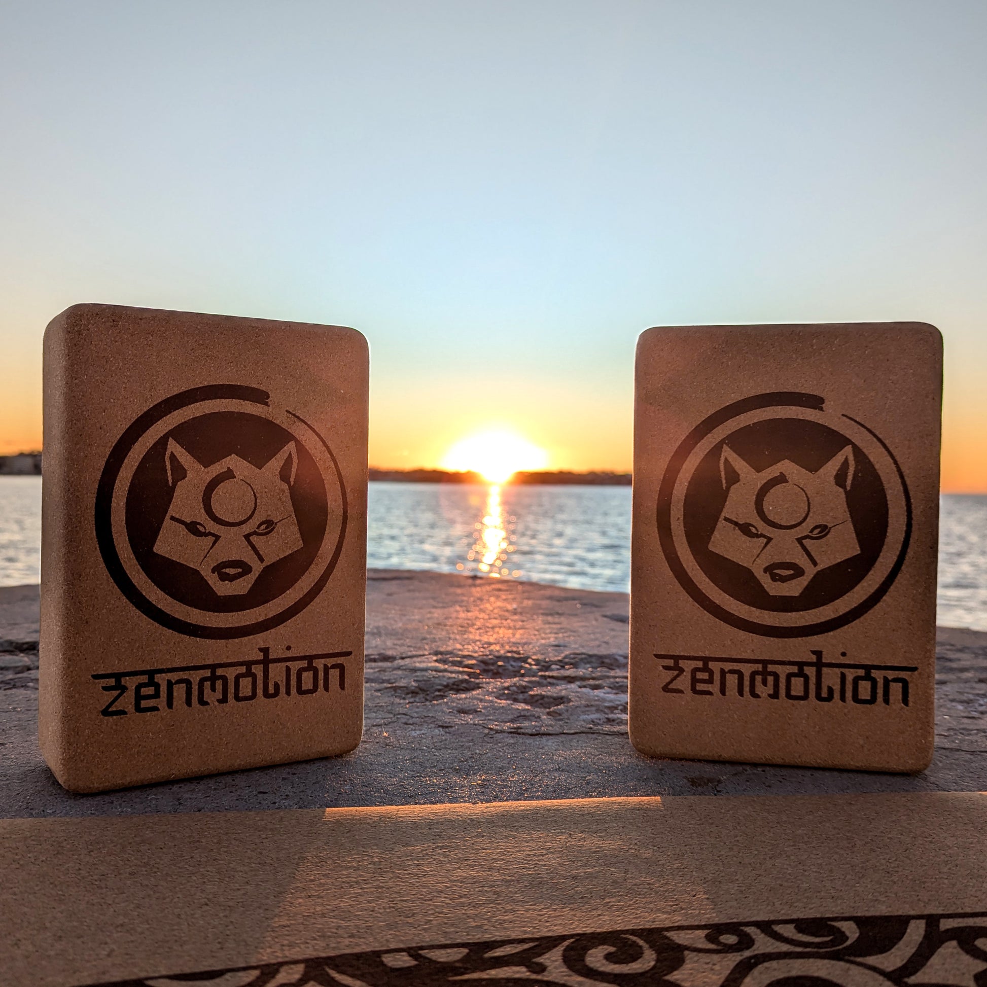 2 ZenMotion Cork Yoga Blocks on a sea background. 