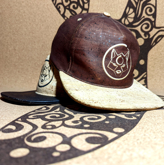 A brown and a natural cork hats with the ZenMotion logo.