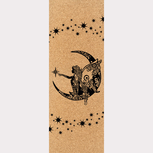 Picture of a cork yoga mat featuring an engraving of a fairy sitting on a moon surrounded by stars.