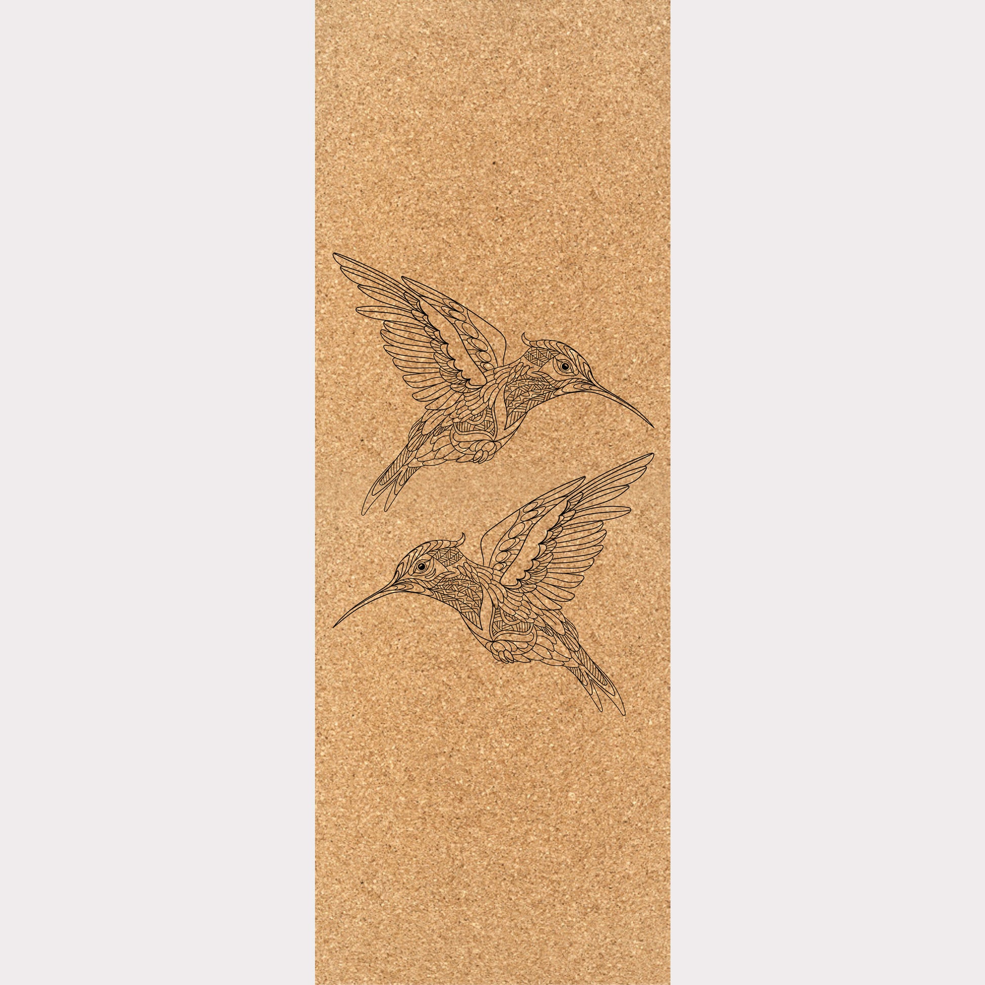 Picture of a cork yoga mat featuring an engraving of two hummingbirds.