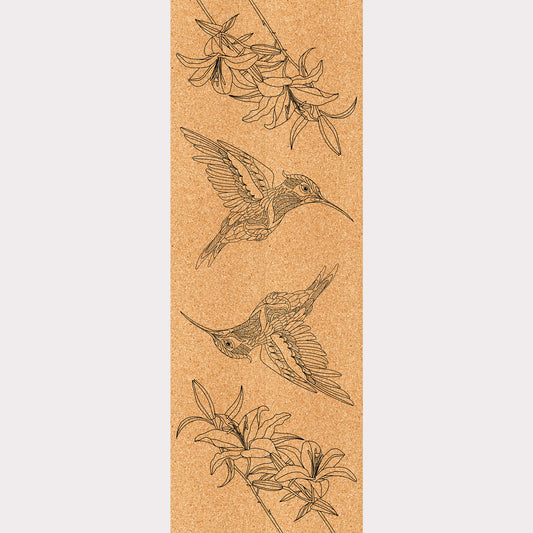 Picture of a cork yoga mat featuring an engraving of two hummingbirds.