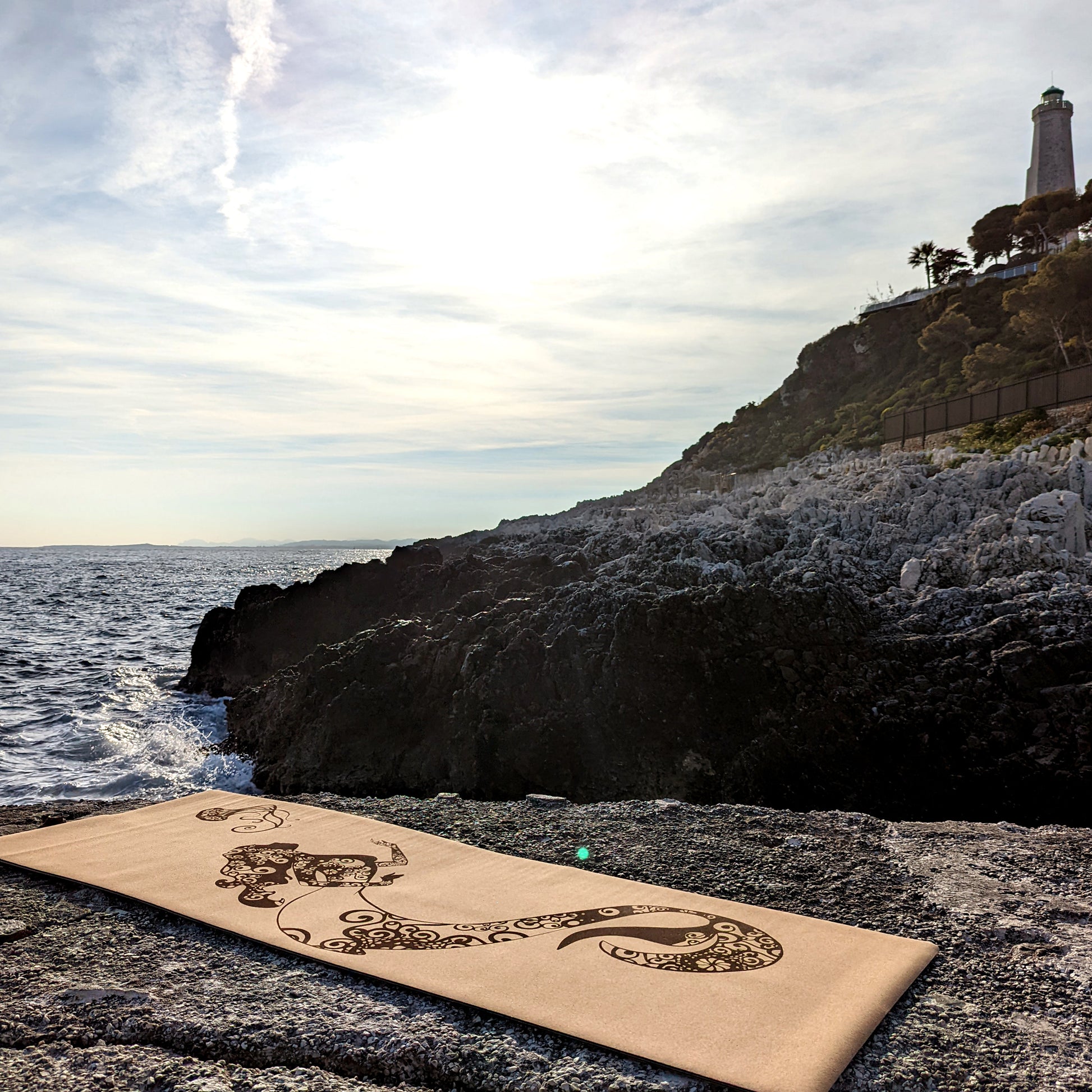 Picture of the Sea Fairy ZenMotion cork yoga mat placed against a tranquil sea background.